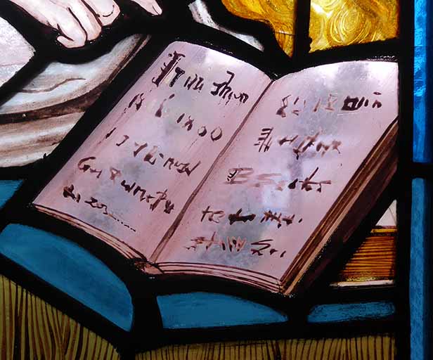 A close-up of a book by the bed