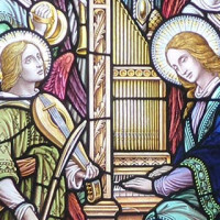 A central image of St. Cecilia and a choir of angels flanked by two images of an individual helping others in the Pre-Raphaelite style