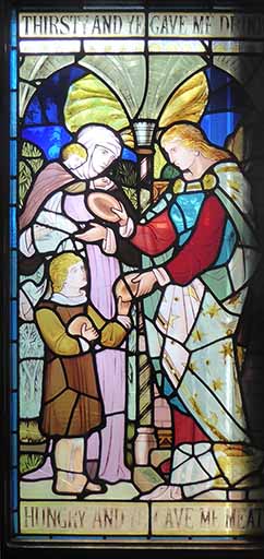 stained glass with the entreaties "Thirsty and ye gave me drink" and "Hungry and ye gave me bread."