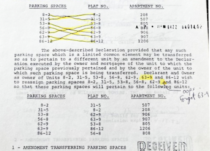 Close-up of the document naming the exchanged parking spaces