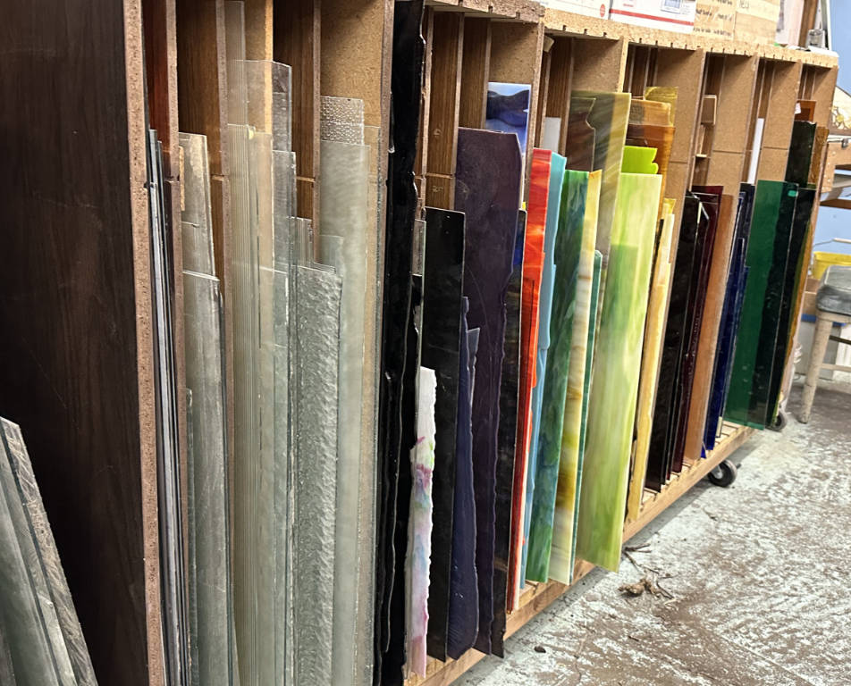 Rack of full sheets of stained glass